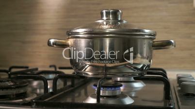 The stainless steel pot on the cooking stove