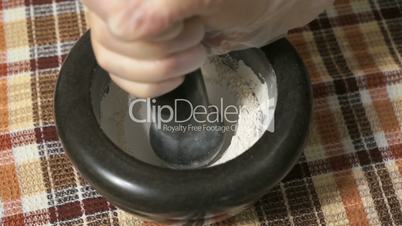 The grinding of the eggshell using mortar