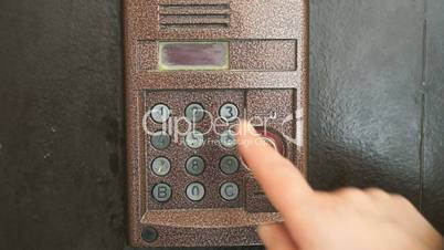 Finger dials apartment old intercom system number