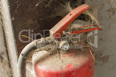 Old dusty fire extinguisher.