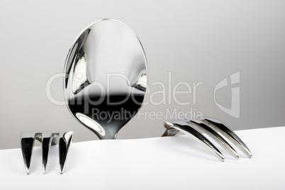 Figure of spoon and two forks.