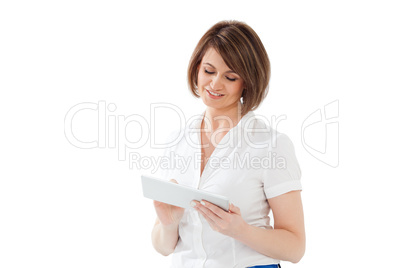 Smiling adult woman using tablet