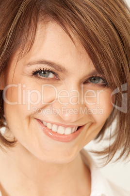 Adult smiling brunette in close-up.