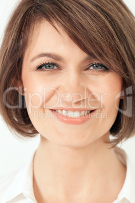 Headshot of adult woman with toothy smile.