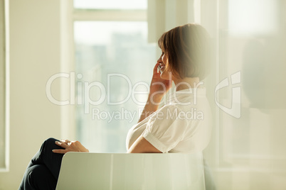 Side view of smiling businesswoman talking on phone