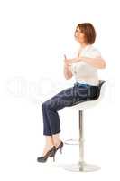 Elegant businesswoman talking while sitting on chair