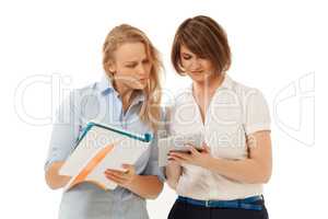 Two businesswomen looking at tablet