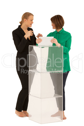 Two women looking to each other while talking