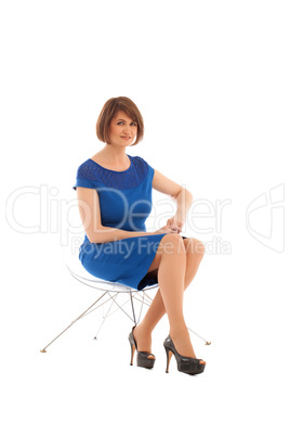 Short haired woman sitting on transparent chair