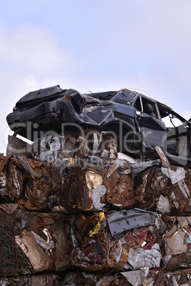 A pile of compressed cars in blocks for processing