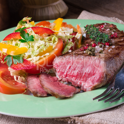 grilled steak with salad