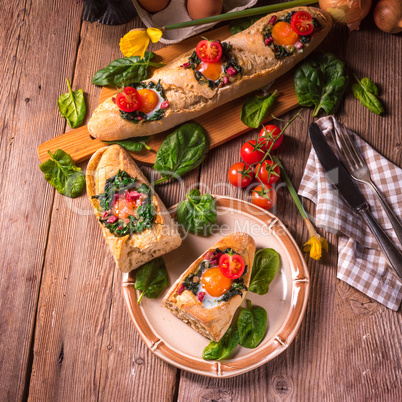 farmer baguette filled with egg, bacon and spinach