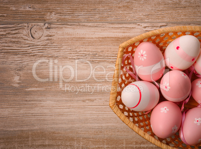 Pink Easter eggs in a basket