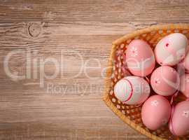 Pink Easter eggs in a basket