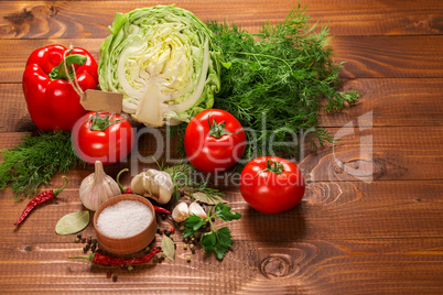 Pepper and tomatoes with garlic on a vintage wooden table with label