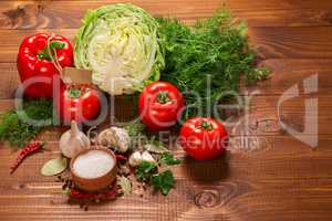 Pepper and tomatoes with garlic on a vintage wooden table with label