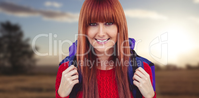 Composite image of smiling hipster woman with a travel bag takin