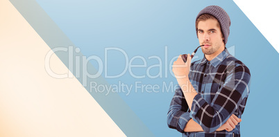 Composite image of portrait of hipster holding smoking pipe