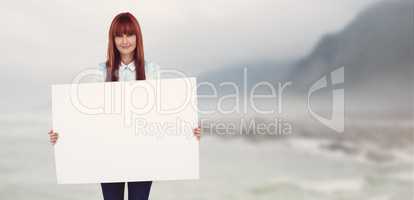 Composite image of attractive hipster woman holding white card