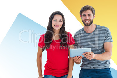 Composite image of couple posing with tablet