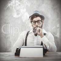 Composite image of hipster smoking pipe while sitting looking at