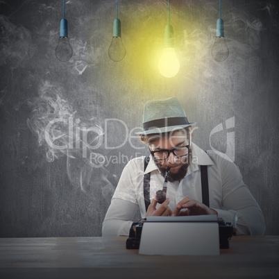 Composite image of hipster smoking pipe while working at desk