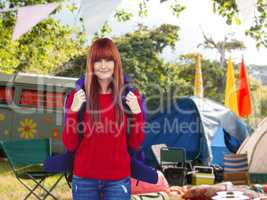 Composite image of smiling hipster woman with a travel bag takin