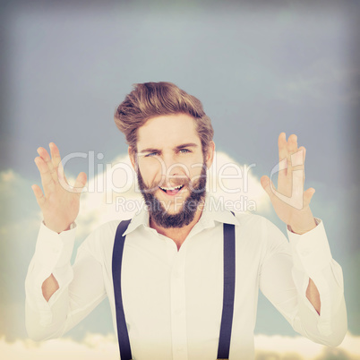 Composite image of portrait of happy hipster gesturing