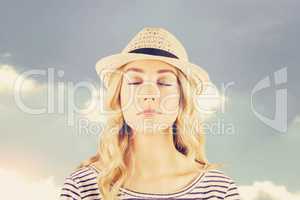 Composite image of gorgeous blonde hipster with straw hat