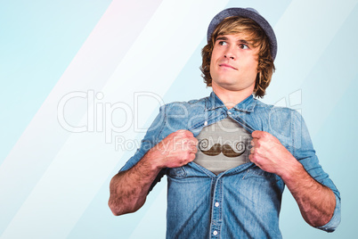 Composite image of funny blond hipster taking off his shirt