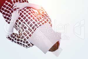 Composite image of creative businessman lying on hardwood floor