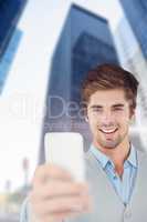 Composite image of happy businessman taking selfie