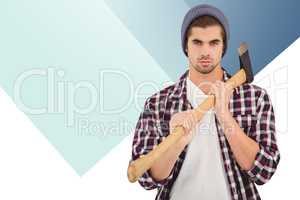 Composite image of portrait of confident man holding axe on shou