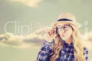 Composite image of gorgeous blonde hipster sending air kiss