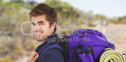 Composite image of side view of happy man with backpack