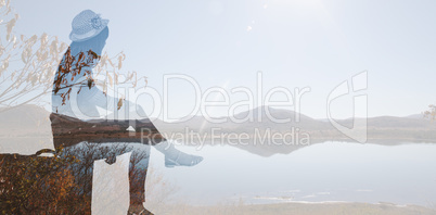 Composite image of hipster woman sitting on her suitcase