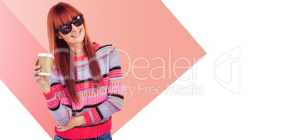 Composite image of attractive hipster woman holding a cup of cof