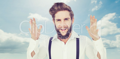 Composite image of portrait of happy hipster gesturing