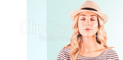 Composite image of gorgeous blonde hipster with straw hat