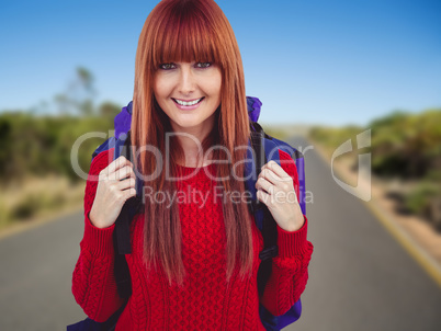 Composite image of smiling hipster woman with a travel bag takin