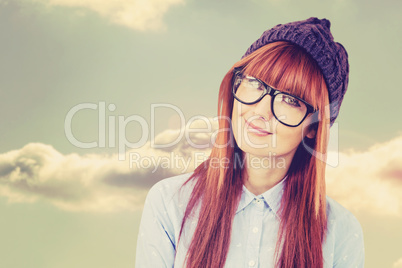 Composite image of smiling hipster woman looking at camera