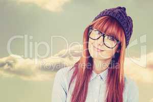 Composite image of smiling hipster woman looking at camera