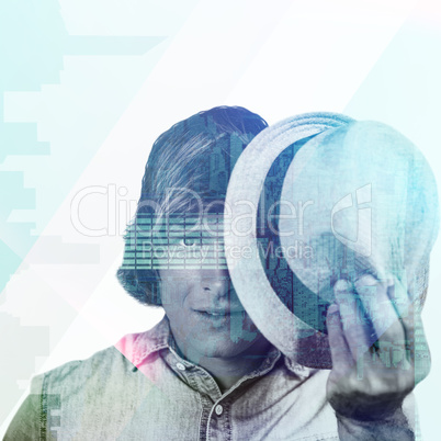 Composite image of focused hipster man hiding his face