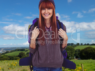 Composite image of smiling hipster woman with a travel bag