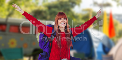 Composite image of smiling hipster woman with a travel bag