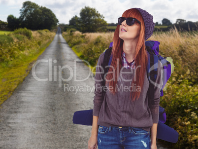 Composite image of portrait of a hipster woman with a travel bag