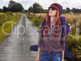 Composite image of portrait of a hipster woman with a travel bag
