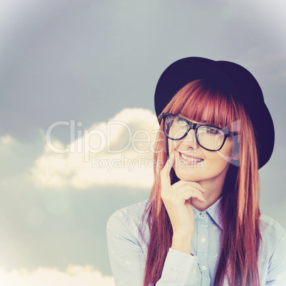 Composite image of smiling hipster woman posing face to the came