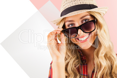 Composite image of gorgeous smiling blonde hipster posing with s