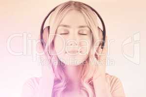 Composite image of close up of a woman listening to music
